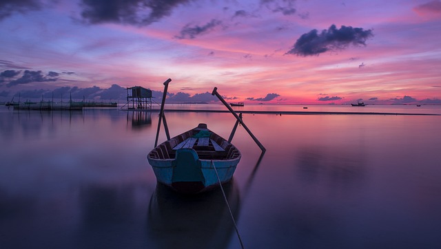 Ocean at sunset with a boat